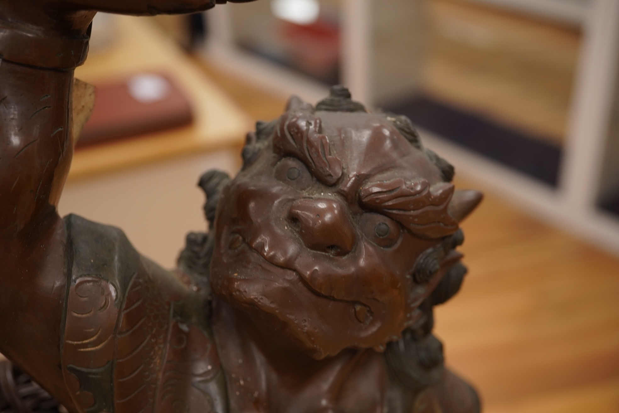 A Japanese bronze model of an oni, Meiji period, now mounted as a lamp, 50cm